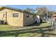 Rear exterior of home, showing the grassy yard and fencing at 1016 W 12Th St, Lakeland, FL 33805