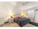 Bright bedroom with large window and neutral color scheme at 1654 Indigo Ave, The Villages, FL 32162