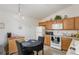 Bright kitchen featuring matching appliances, a breakfast nook, and ample cabinet space at 1654 Indigo Ave, The Villages, FL 32162