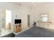 The main bedroom features neutral walls and ensuite bathroom at 1654 Indigo Ave, The Villages, FL 32162