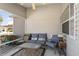 Enclosed porch with comfortable seating at 1654 Indigo Ave, The Villages, FL 32162