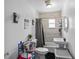 Well-lit bathroom with new bathtub, modern fixtures, and tiled walls at 828 W 13Th St, Lakeland, FL 33805