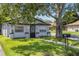 Delightful home offering a lush green lawn, sidewalk and mailbox at 828 W 13Th St, Lakeland, FL 33805