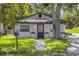 Charming single story home with fresh green lawn and mature tree at 828 W 13Th St, Lakeland, FL 33805