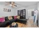 Comfortable living room featuring a plush couch, hardwood floors, and natural light at 828 W 13Th St, Lakeland, FL 33805