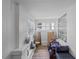 Bright sunroom with large windows and wood-look laminate flooring provides a cheerful space at 828 W 13Th St, Lakeland, FL 33805