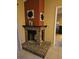 Brick fireplace and hearth in living area at 3881 Villa Rose Ln, Orlando, FL 32808