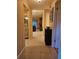 Inviting hallway featuring tile flooring and seamless transitions to the kitchen and living areas at 3881 Villa Rose Ln, Orlando, FL 32808