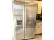 Stainless steel refrigerator adding style to the functional kitchen space at 3881 Villa Rose Ln, Orlando, FL 32808