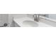 Pristine white sink and countertop with sleek faucet in a well-lit bathroom at 5224 Stone Ridge Pl, St Cloud, FL 34771