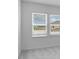 Bedroom with large windows offering neighborhood views, bringing in natural light at 5224 Stone Ridge Pl, St Cloud, FL 34771