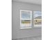 Bedroom with large windows offering neighborhood views, bringing in natural light at 5224 Stone Ridge Pl, St Cloud, FL 34771