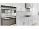 Bright kitchen with stainless steel oven and gas range, white cabinets and marble backsplash at 5224 Stone Ridge Pl, St Cloud, FL 34771