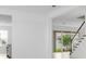Bright, open-concept living area features sleek floors, natural light, and staircase at 5224 Stone Ridge Pl, St Cloud, FL 34771