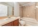 Bathroom featuring a bath tub with shower and vanity with updated faucet and mirror at 5331 River Rock Rd, Lakeland, FL 33809