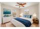 Staged bedroom with serene blue accents and ample natural light at 5331 River Rock Rd, Lakeland, FL 33809