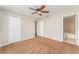 Bedroom featuring a ceiling fan, neutral walls, and direct access to an ensuite bathroom at 5331 River Rock Rd, Lakeland, FL 33809