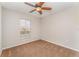 Neutral bedroom with a ceiling fan, brown carpet and one window at 5331 River Rock Rd, Lakeland, FL 33809