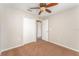 Neutral bedroom with a ceiling fan and closet that also includes a direct access to a shared bathroom at 5331 River Rock Rd, Lakeland, FL 33809