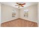 Cozy bedroom featuring natural light, a ceiling fan, and neutral-toned walls at 5331 River Rock Rd, Lakeland, FL 33809