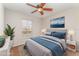 Cozy bedroom with a ceiling fan, rug, and a view from the window at 5331 River Rock Rd, Lakeland, FL 33809