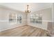 Dining area with wood-look floors and ample natural light from the windows at 5331 River Rock Rd, Lakeland, FL 33809