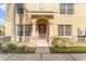 Charming yellow two-story home with a covered front entrance and a well-maintained yard at 5331 River Rock Rd, Lakeland, FL 33809