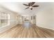 Inviting living space with wood-look floors, ceiling fan, and dining area at 5331 River Rock Rd, Lakeland, FL 33809