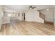 Spacious living room featuring light wood floors and a staircase leading to the second level at 5331 River Rock Rd, Lakeland, FL 33809