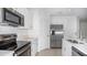 Bright kitchen featuring stainless steel appliances and white cabinets at 2072 Rosewood Cir, Lakeland, FL 33810