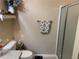 Clean bathroom featuring a glass shower, a decorative shelf, and neutral colored walls at 1565 Hancock St, The Villages, FL 32162