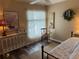 Inviting bedroom with decorative touches, a comfortable daybed, and modern decor at 1565 Hancock St, The Villages, FL 32162