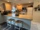 Kitchen boasts ample counter space and a breakfast bar for casual dining at 1565 Hancock St, The Villages, FL 32162