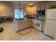 Functional kitchen featuring updated appliances and plenty of cabinet storage at 1565 Hancock St, The Villages, FL 32162