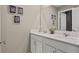 Bright bathroom with double sink vanity, white cabinetry, and elegant fixtures at 4729 Golden Knight Blvd, Kissimmee, FL 34746