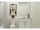 Bathroom featuring a toilet, vanity with sink, framed artwork, and modern fixtures at 5287 Dagenham Dr, Davenport, FL 33837