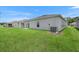A backyard with a lush green lawn at 1931 Rosewood Cir, Lakeland, FL 33810