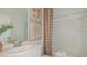 Clean bathroom with a single vanity, large mirror, and shower-tub combination at 1931 Rosewood Cir, Lakeland, FL 33810