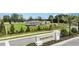 Ironwood community sign surrounded by green lawns, landscaping and palm trees at 1931 Rosewood Cir, Lakeland, FL 33810
