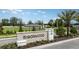 Ironwood community entrance sign amidst lush landscaping and blue sky at 1931 Rosewood Cir, Lakeland, FL 33810