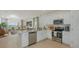 Modern kitchen with stainless steel appliances, white cabinets, and a center island at 1931 Rosewood Cir, Lakeland, FL 33810