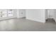 Spacious living room features tile flooring, large windows and plenty of natural light at 1931 Rosewood Cir, Lakeland, FL 33810