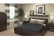 Cozy bedroom with a padded headboard, neutral decor, and natural light from a window at 2577 Cotton Candy Aly, Kissimmee, FL 34744