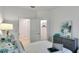 Comfortable bedroom featuring a bed, dresser, and walk-in closet with ample storage space at 4208 Nightcaps Way, Kissimmee, FL 34746
