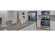 Modern kitchen featuring stainless steel appliances, white cabinetry, and island with countertop seating at 4208 Nightcaps Way, Kissimmee, FL 34746