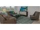 Cozy living room with comfortable seating and a contemporary decor, perfect for relaxation and entertainment at 4208 Nightcaps Way, Kissimmee, FL 34746