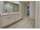 Bathroom featuring double sinks and a bright white shower at 1040 Cambridge Drive, Winter Haven, FL 33881