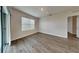 Bright bedroom with wood-look floors and a large window at 1040 Cambridge Drive, Winter Haven, FL 33881