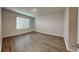 Inviting bedroom featuring wood-look floors and ample natural light at 1040 Cambridge Drive, Winter Haven, FL 33881