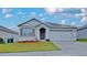 Charming one-story home with a well-manicured lawn and neutral color palette at 1040 Cambridge Drive, Winter Haven, FL 33881
